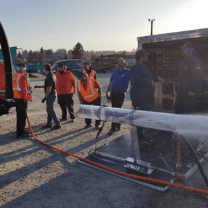 In the image, a team of professionals in work attire is seen operating hydro jetting equipment to clean plumbing pipes. The setting is in Washington State, specifically serving Pierce and King County. The powerful water jetting technology is used to clear debris, sediment, and blockages from the pipes, ensuring optimal plumbing performance. The focused actions of the team underscore their expertise and commitment to effective plumbing solutions. This image highlights FloHawk's advanced approach to maintaining and restoring plumbing systems in the region. Trust them for reliable hydro jetting services tailored to local needs, ensuring your plumbing operates efficiently and reliably.