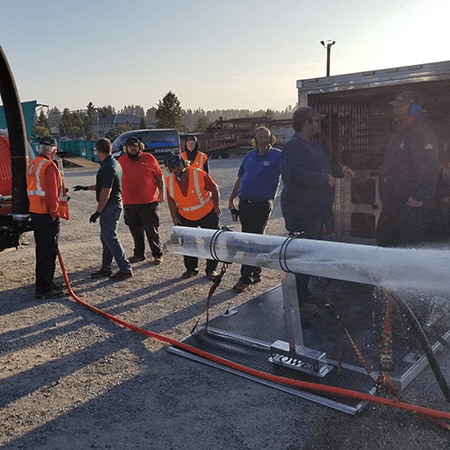 In the image, a team of professionals in work attire is seen operating hydro jetting equipment to clean plumbing pipes. The setting is in Washington State, specifically serving Pierce and King County. The powerful water jetting technology is used to clear debris, sediment, and blockages from the pipes, ensuring optimal plumbing performance. The focused actions of the team underscore their expertise and commitment to effective plumbing solutions. This image highlights FloHawk's advanced approach to maintaining and restoring plumbing systems in the region. Trust them for reliable hydro jetting services tailored to local needs, ensuring your plumbing operates efficiently and reliably.